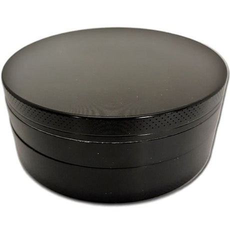 Side profile view of the Smoke Zilla Jumbo Aluminum Grinder 98mm in sleek metallic black. The durable exterior is crafted with textured ridges along the top and bottom lids to provide users with a non-slip grip for effortless twisting.