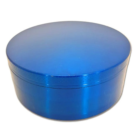 Side profile view of the Smoke Zilla Jumbo Aluminum Grinder 98mm in sleek metallic blue. The durable exterior is crafted with textured ridges along the top and bottom lids to provide users with a non-slip grip for effortless twisting.