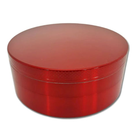Side profile view of the Smoke Zilla Jumbo Aluminum Grinder 98mm in sleek metallic red. The durable exterior is crafted with textured ridges along the top and bottom lids to provide users with a non-slip grip for effortless twisting.
