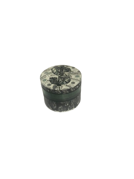 Angled overhead view of the Smoke Zilla Magnetic Grinder featuring a melting money decal. The built-in magnetic center post ensures the lid stays firmly attached to the grinding chamber while in pockets or bags.