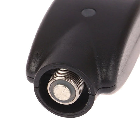 Angled top down view of the Smooth USB battery charger highlighting the metallic silver 510 thread connection. The precisely machined threads securely hold most standard vape pen batteries to ensure a stable and safe electrical connection while charging.