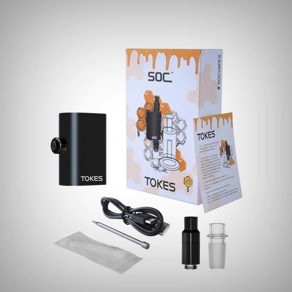 Angled overhead view of the complete SOC Tokes dual use wax vaporizer enail kit laid out against a clean white background. This comprehensive concentrate starter set includes the 650mAh battery base, wax tank, 14mm male adapter, a stainless steel dab tool, cleaning swabs, and a fast-charging Type-C USB cable.