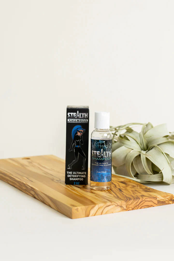Front angled view of the Stealth 2oz Hair Purifying Shampoo bottle in bold black and green. This fast-acting clarifying shampoo penetrates deep into the hair shaft to actively strip away stubborn toxins and chemical impurities for a complete cleanse.
