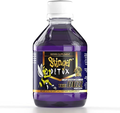 Front angled view of the Stinger Detox The Buzz 5x Liquid 8oz bottle in vibrant purple. This extra-strength, fast-acting detox drink is formulated to work naturally with your body to flush out toxins for a rapid same-day cleanse.