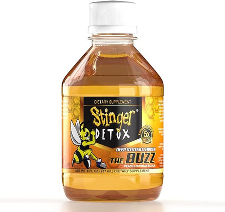 Front angled view of the Stinger Detox The Buzz 5x Liquid 8oz bottle in vibrant yellow. This extra-strength, fast-acting detox drink is formulated to work naturally with your body to flush out toxins for a rapid same-day cleanse.
