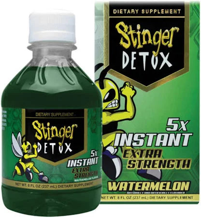 Front angled view of the Stinger Detox The Buzz 5x Liquid 8oz bottle in vibrant green. This extra-strength, fast-acting detox drink is formulated to work naturally with your body to flush out toxins for a rapid same-day cleanse.