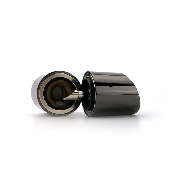 Angled close-up view of the Stone Smiths' Slash Vaporizer magnetic mouthpiece in black, showing the underside and attached metal dab pick. The ergonomic mouthpiece uses an innovative top airflow system and an integrated tool that makes loading fast and easy without sticky threaded caps.