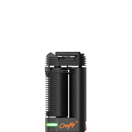 Front view of the Storz & Bickel Crafty+ dry herb vaporizer in matte black with a vibrant orange button. This compact portable device utilizes a patented combination of convection and conduction heating to deliver outstanding vapor quality and pure flavor on the go.