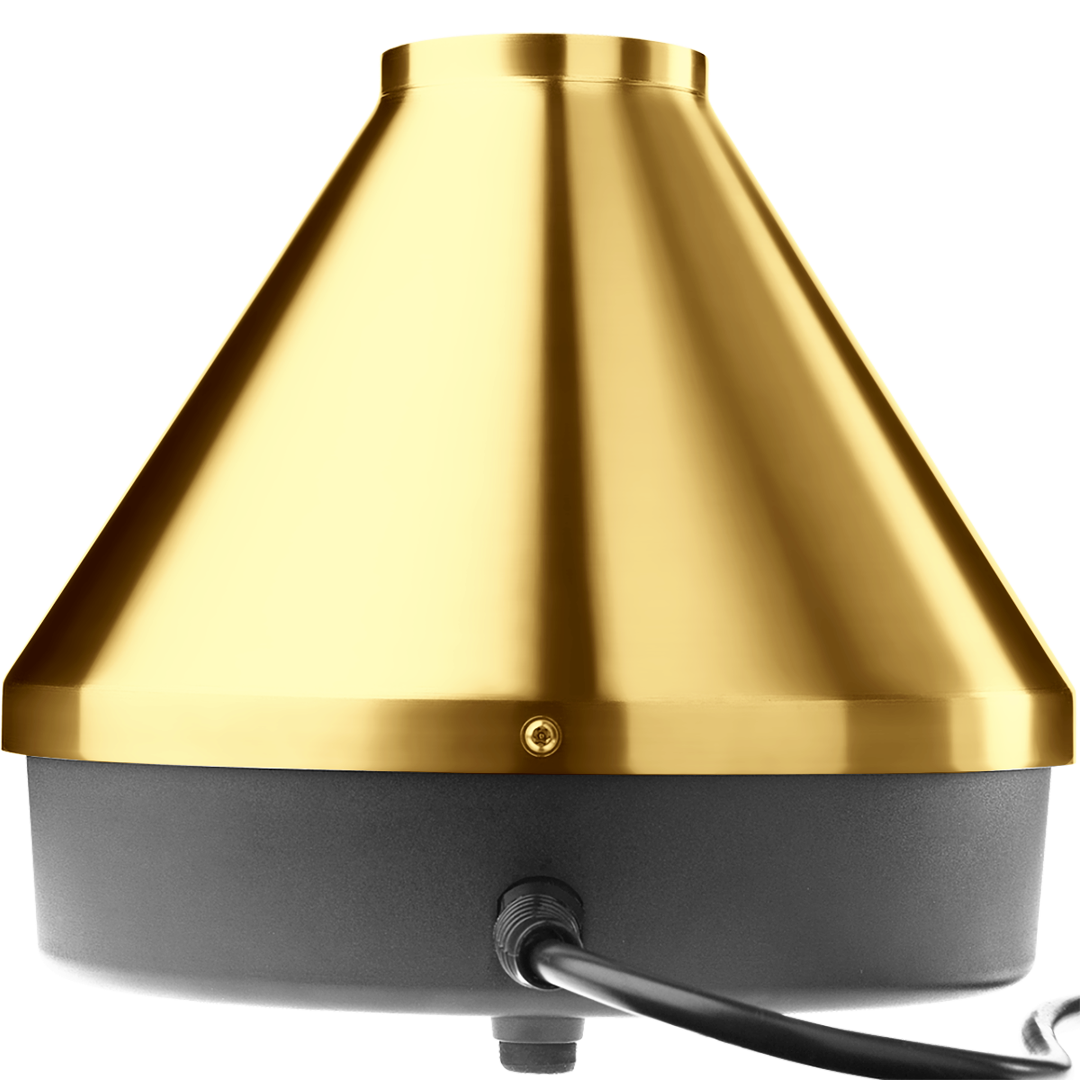 rear angled view of the Storz & Bickel Volcano Classic in striking 24-karat gold. This legendary desktop vaporizer features a robust electromechanical design and convection heating for pure dry herb vaporization.