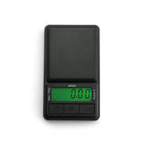 Close-up front view of the Truweigh Apex digital mini scale control panel in black. The crisp backlit LCD screen provides clear visibility in low light, while the intuitive buttons feature a tare function to easily zero out container weights.