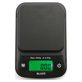Angled overhead view of the Truweigh Blaze digital scale in black. This ultra-precise 100g x 0.01g variant is perfect for measuring fine materials, concentrates, and exact micro-doses.