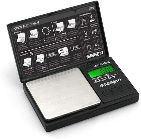 Front angled view of the Truweigh Mini Classic digital scale in sleek black. This ultra-compact pocket scale features a 100g maximum capacity and an ultra-precise 0.01g readability for accurately measuring fine botanical herbs and solid concentrates.