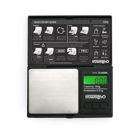 Front angled view of the Truweigh Mini Classic digital scale in sleek black. This ultra-compact pocket scale features a 100g maximum capacity and an ultra-precise 0.01g readability for accurately measuring fine botanical herbs and solid concentrates.