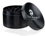 Front view of the Tsunami 100mm sunken top herb grinder in sleek black. This extra-large, premium aluminum grinder features a unique bowl-shaped top perfect for conveniently mixing and rolling your dry herbs.