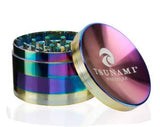 Front view of the Tsunami 100mm sunken top herb grinder in sleek rainbow. This extra-large, premium aluminum grinder features a unique bowl-shaped top perfect for conveniently mixing and rolling your dry herbs.