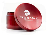 Front view of the Tsunami 100mm sunken top herb grinder in sleek red. This extra-large, premium aluminum grinder features a unique bowl-shaped top perfect for conveniently mixing and rolling your dry herbs.