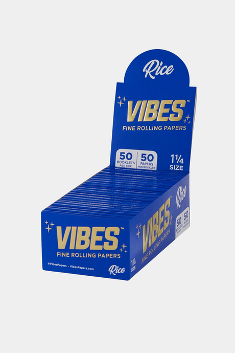 front view of the Vibes rice rolling papers. In their blue and gold display box these 1 1/4 papers are high quality and great for any smoker.
