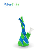Front profile view of the Waxmaid 8.5 Inch Hobee's Silicone Beaker Water Pipe in a marbled blend of blue, white, and green. This platinum-cured silicone water pipe features a traditional beaker design that is completely unbreakable for reliable travel use.