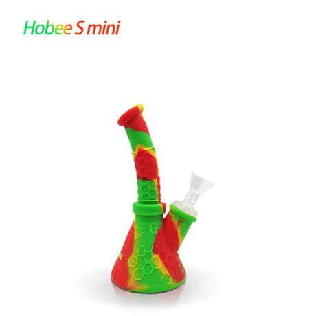 Front profile view of the Waxmaid 8.5 Inch Hobee's Silicone Beaker Water Pipe in vibrant rasta red, yellow, and green. This platinum-cured silicone water pipe features a traditional beaker design that is completely unbreakable for reliable travel use.