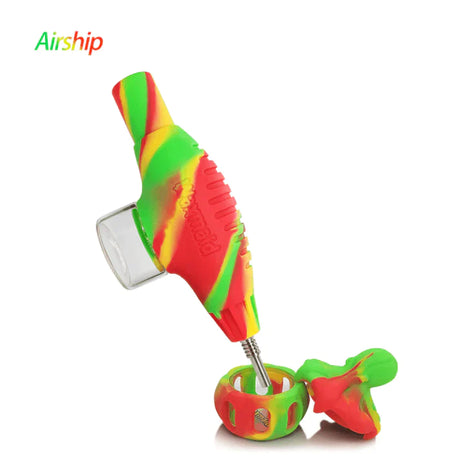 Front angled view of the Waxmaid Airship Silicone Nectar Collector Kit in a vibrant multicolored rasta swirl. This futuristic space-themed dab straw kit includes a durable silicone body and a medical-grade titanium nail tip for smoothly vaporizing solid wax and essential oils.