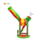 Front angled view of the Waxmaid Gemini 2-in-1 Silicone Pipe in a vibrant multicolored rasta swirl. This versatile hybrid smoking accessory functions as a durable, drop-proof hand pipe for enjoying dry herb.