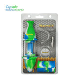 Front view of the 8-inch Waxmaid Upgraded Capsule Kit clad in a vibrant blue, white, and green swirled silicone sleeve. This durable hybrid water pipe utilizes an impact-resistant outer skin to safeguard the inner glass chamber from damage.