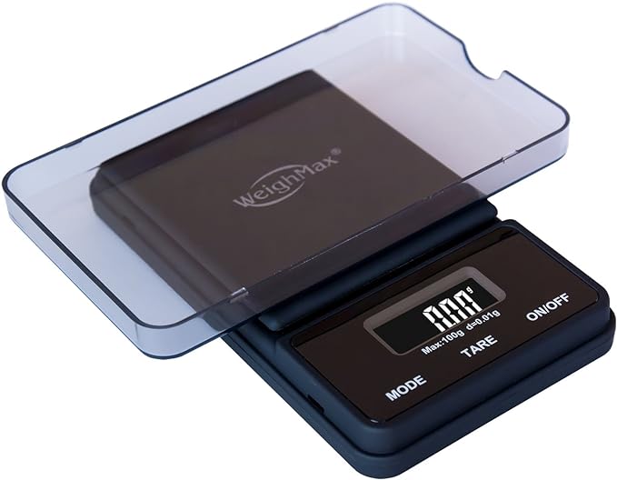 Front angled view of the Weighmax Ninja digital scale in sleek black. This portable pocket scale features high-precision weighing capabilities, a backlit LCD display, and a stainless steel platform for accurately measuring botanical herbs and concentrates.