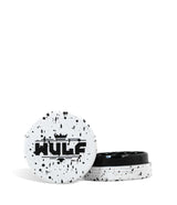 Front angled view of the Wulf Mods 2-Piece 50mm Spatter Aluminum Grinder in white with black paint splatter. This ultra-compact, travel-friendly magnetic herb grinder features a streamlined two-piece design to quickly and efficiently shred your botanical blends without any extra bulk.