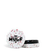 Front angled view of the Wulf Mods 2-Piece 50mm Spatter Aluminum Grinder in white with vibrant red paint splatter. This ultra-compact, travel-friendly magnetic herb grinder features a streamlined two-piece design to quickly and efficiently shred your botanical blends without any extra bulk.