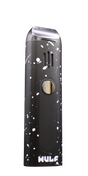 Angled view of the Wulf Mods Flora vaporizer in black and white splatter. This portable dry herb vaporizer features an anodized aluminum chassis and rapid heating for on-the-go 