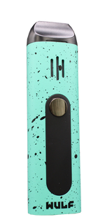 Angled view of the Wulf Mods Flora vaporizer in green and black splatter. This portable dry herb vaporizer features an anodized aluminum chassis and rapid heating for on-the-go sessions.