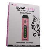 Front view of the Wulf Mods Flora vaporizer in pink and black splatter. The device includes an intuitive OLED display and temperature control buttons for precise botanical heating.